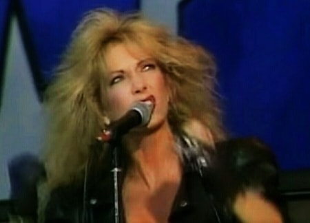 Emi Canyn performing on stage for her band